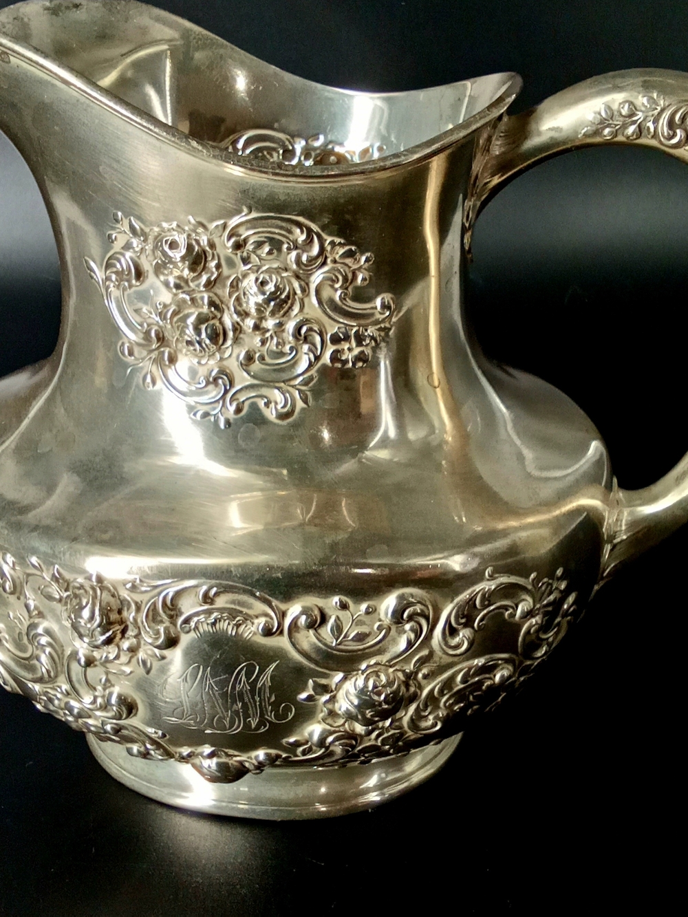 Ornate Sterling Silver mbossed Pitcher
